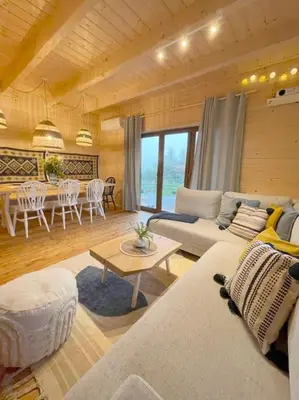 a living room with a couch and a table at Panorama Sucha Góra in Skawica