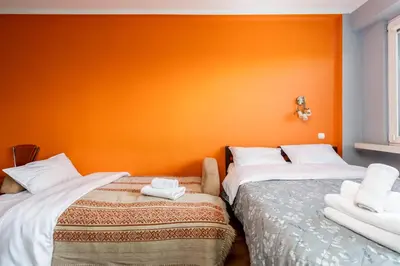 a living room with a couch and a table at Zielona Nowa Huta Apartment by BookingHost in Kraków