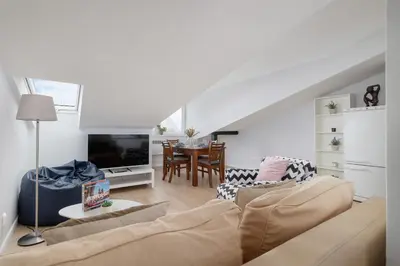 a living room with a couch and a table at Apartment with 2 Bedrooms and Desks in the Center of Cracow by Noclegi Renters in Kraków