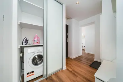 a laundry room with a washer and dryer at Close to everywhere, cosy place in Kraków