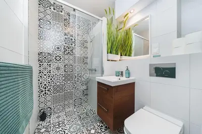 a bathroom with a shower and a sink and a toilet at Close to everywhere, cosy place in Kraków