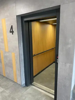 a door in a building with the number four at Przewóz Lux Lucky Apartments Garaż w cenie in Kraków