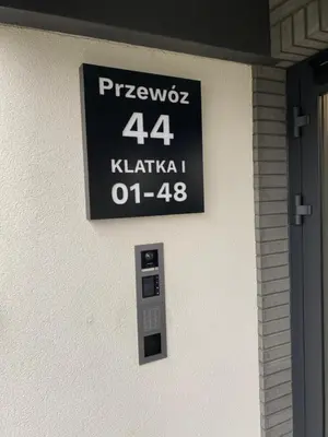 a sign on the side of a building at Przewóz Lux Lucky Apartments Garaż w cenie in Kraków