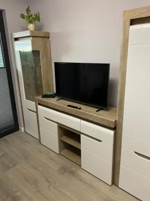 a entertainment center with a flat screen tv on top at Przewóz Lux Lucky Apartments Garaż w cenie in Kraków