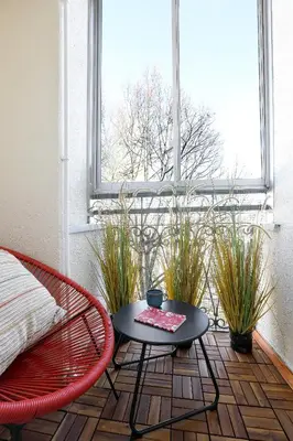 a room with a table and a chair and a window at Cozy studio with Air Conditioning for couples, Old Town - Jewish District in Kraków