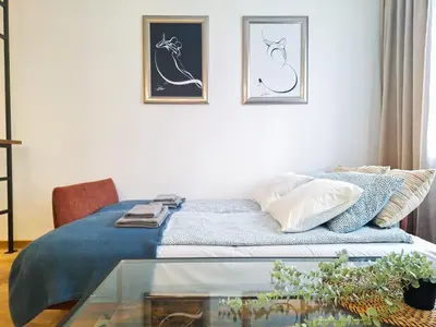 a bedroom with a bed and a glass table at Cozy studio with Air Conditioning for couples, Old Town - Jewish District in Kraków