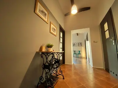 a hallway with a table in the middle of a room at Luxury, spacious apartament with two bedrooms and balcony in Przybysławice