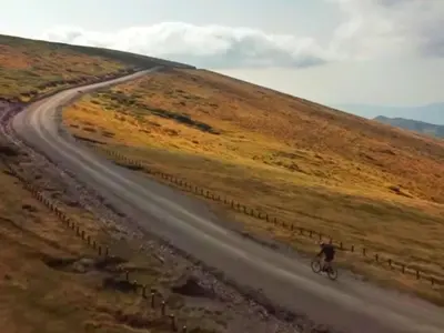 a person riding a bike down a dirt road at Luxury, spacious apartament with two bedrooms and balcony in Przybysławice