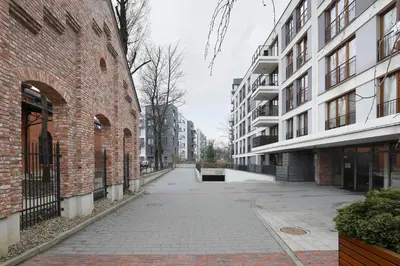 an empty street in a city with buildings at Classy 2-room Apartment with Private Garden and Air Conditioning- Old Town in Kraków