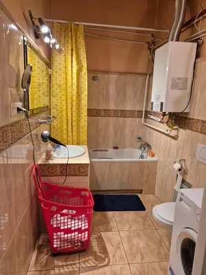 a small bathroom with a sink and a toilet at Agnieszki Pokoj nr 2 in Kraków