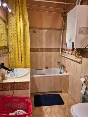 a bathroom with a tub and a sink at Agnieszki Pokoj nr 3 in Kraków