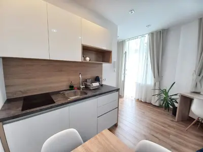 a kitchen with a sink and a counter top at Old Town Apartmens - B33 in Kraków