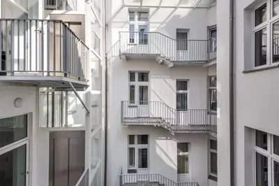 an apartment building with balconies on the side of it at Old Town Apartmens - B33 in Kraków