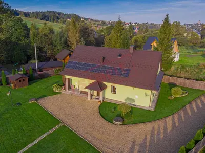 an overhead view of a house with solar panels on it at Apartament Zielona Willa in Skomielna Biała