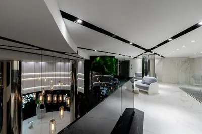 a living room with a glass wall at Wiślane Tarasy - UNIQUE Apartments 4YOU - 10 piętro z pięknym widokiem na centrum Krakowa in Kraków