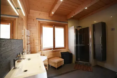a bathroom with a sink and a shower at Chata Palarówka in Grzechynia
