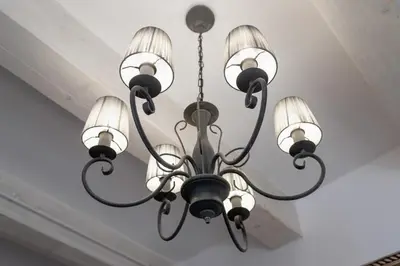 a chandelier hanging from a ceiling at Lux Studio City Center Sołtyka by Noclegi Renters in Kraków