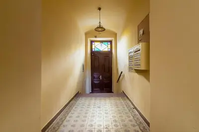 a hallway with a door and a tile floor at Lux Studio City Center Sołtyka by Noclegi Renters in Kraków