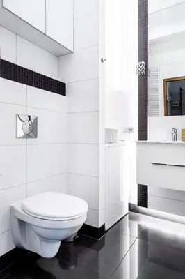 a white bathroom with a toilet and a tub at Househost Apartment: Józefa 2/10 in Kraków