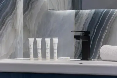a bathroom counter with a row of toothbrushes on it at Unique Apartment with Balcony & Parking Zabłocie Cracow by Renters Prestige in Kraków
