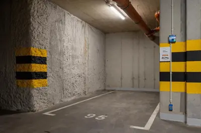an empty room with yellow and black stripes on the wall at Unique Apartment with Balcony & Parking Zabłocie Cracow by Renters Prestige in Kraków
