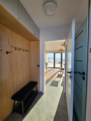 a hallway with a bench in a house at Okno Na Góry in Klikuszowa