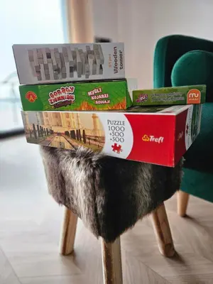 three pizza boxes sitting on top of a table at Okno Na Góry in Klikuszowa
