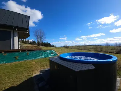 a large blue tub sitting on a table in a yard at Okno Na Góry in Klikuszowa