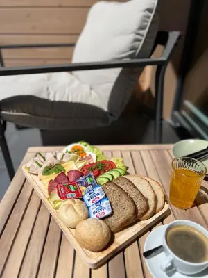 a tray of sandwiches and bread on a table at DOMKI NA LUZIE w górach PREMIUM , dla dorosłych i młodzieży in Spytkowice