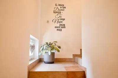 a stairwell with a potted plant on the wall at Studio D&D Przeciszów in Przeciszów