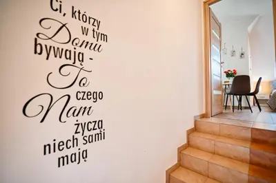 a wall sticker of a staircase with words on it at Studio D&D Przeciszów in Przeciszów