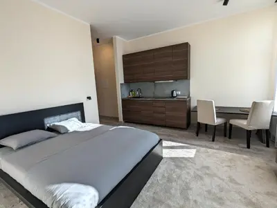 a bedroom with a bed and a table and chairs at Apartment A2 in Downtown of Krakow in Kraków
