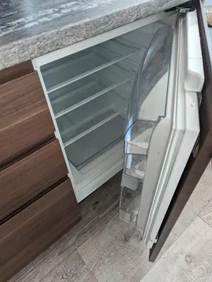 an empty refrigerator in a kitchen with its door open at Apartment A2 in Downtown of Krakow in Kraków