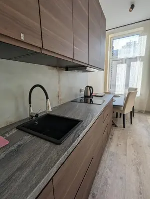 a kitchen with a sink and a counter top at Apartment A2 in Downtown of Krakow in Kraków
