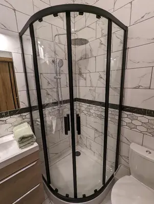 a glass shower in a bathroom with a toilet at Apartment A2 in Downtown of Krakow in Kraków