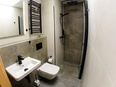 a bathroom with a sink and a shower at Hot Jacuzzi in Cracow in Kraków