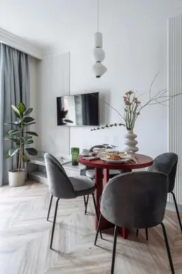 a dining room with a table and chairs at MameHome Apartments in Kraków