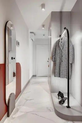 a dressing room with a mirror and a walk in closet at MameHome Apartments in Kraków