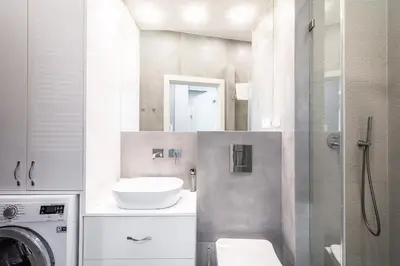 a bathroom with a sink and a washing machine at RentPlanet - Apartament Wieliczka in Wieliczka