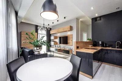 a kitchen and dining room with a white table and chairs at RentPlanet - Apartament Wieliczka in Wieliczka