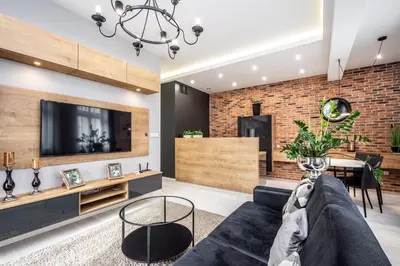a living room with a couch and a tv at RentPlanet - Apartament Wieliczka in Wieliczka