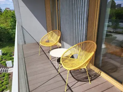 a bedroom with a large bed with towels on it at InPoint Modern Apartment Lema 17-Tauron Arena & Free Parking Self Check-in in Kraków