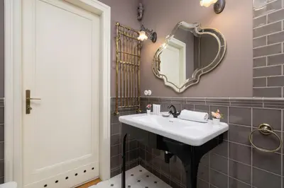 a bathroom with a sink and a mirror at Luxury Apartment with Two Bedrooms and Balcony by Renters Prestige in Kraków