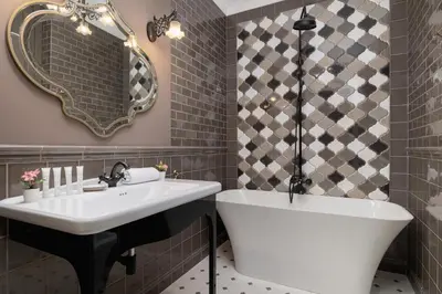 a bathroom with a tub and a sink and a mirror at Luxury Apartment with Two Bedrooms and Balcony by Renters Prestige in Kraków