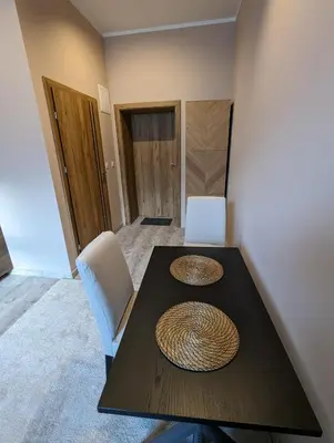 a dining room table with two baskets on top of it at Apartment A1 in Downtown of Krakow in Kraków