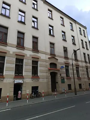a building with a bike parked in front of it at Apartment A1 in Downtown of Krakow in Kraków