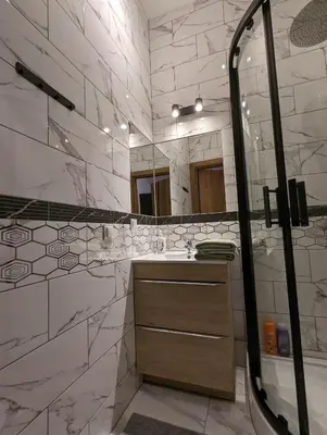 a bathroom with a sink and a mirror at Apartment A1 in Downtown of Krakow in Kraków