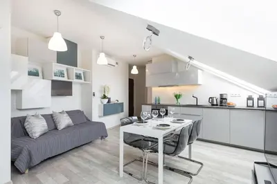 a living room with a table and a couch at MODERN & NEW place next to Wawel Castle & Vistula in Kraków