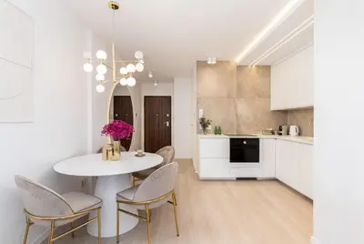 a bathroom with a sink and a bottle of wine at Glossy Apart G29 in Kraków