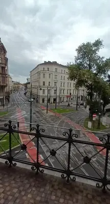a view of a city street from a fence at Royal Castle Apartments in Kraków